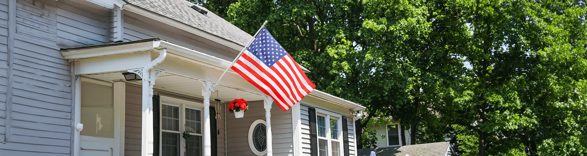 A house with an American flag flying outside
