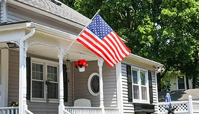 A house with an American flag flying outside