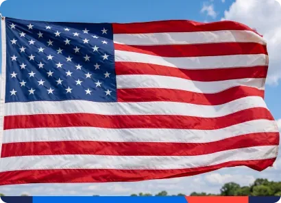 An American flag against a blue sky